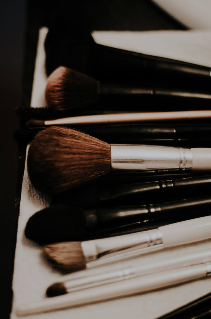 various makeup brushes laying flat