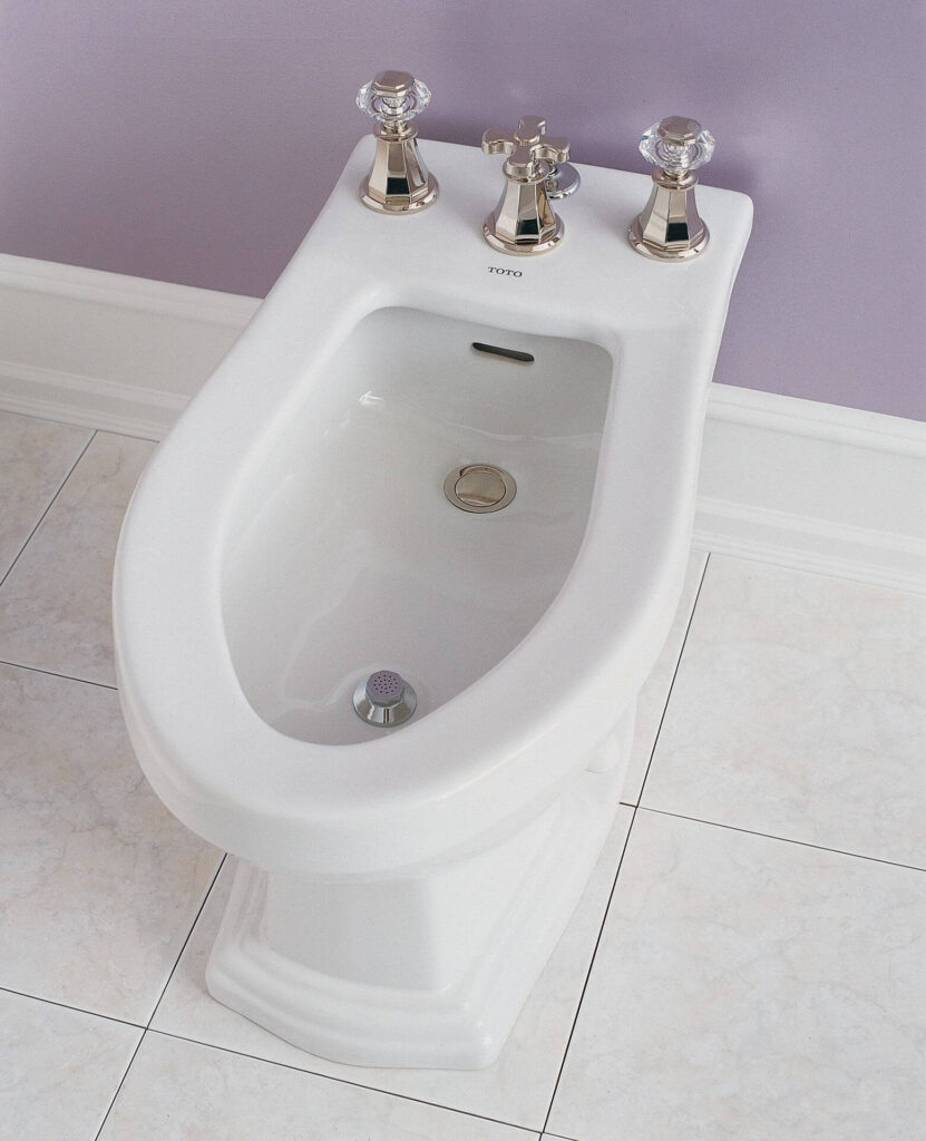 Toto bidet with golden knobs