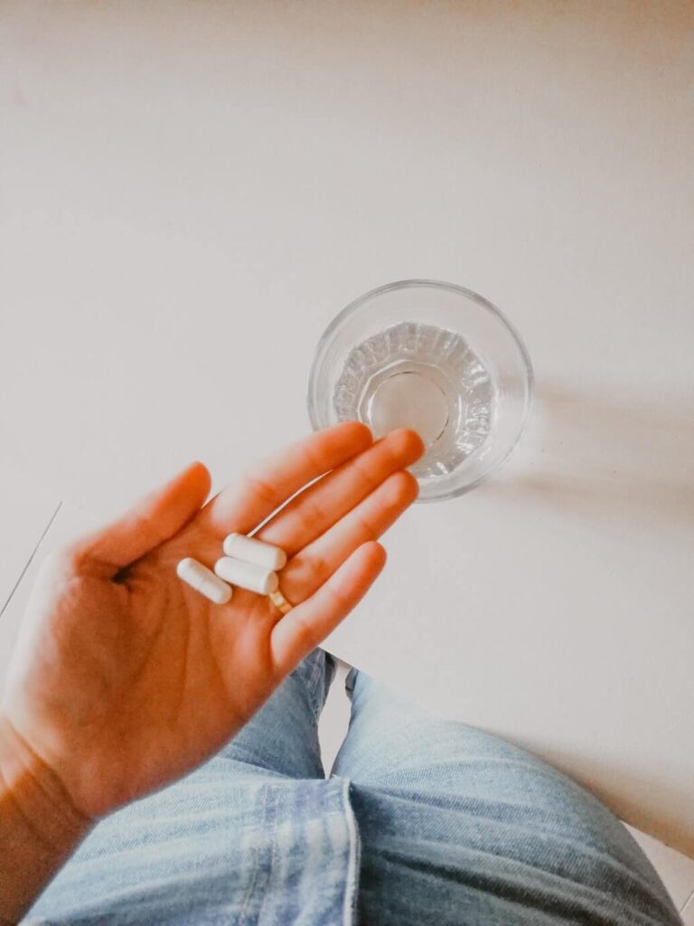 a person holding white medication