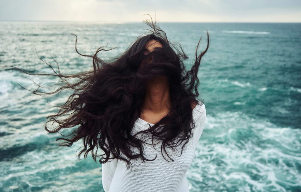 woman standing near a body of water