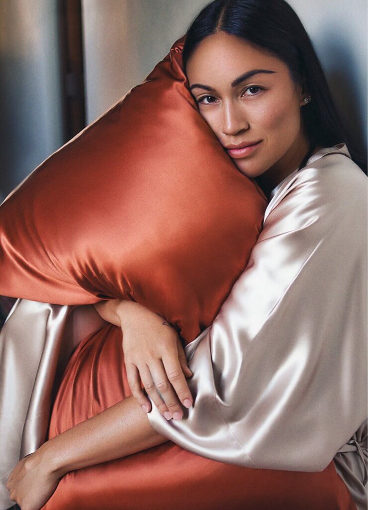 a woman hugging a pillow