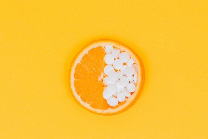 orange slice and medicine tablets