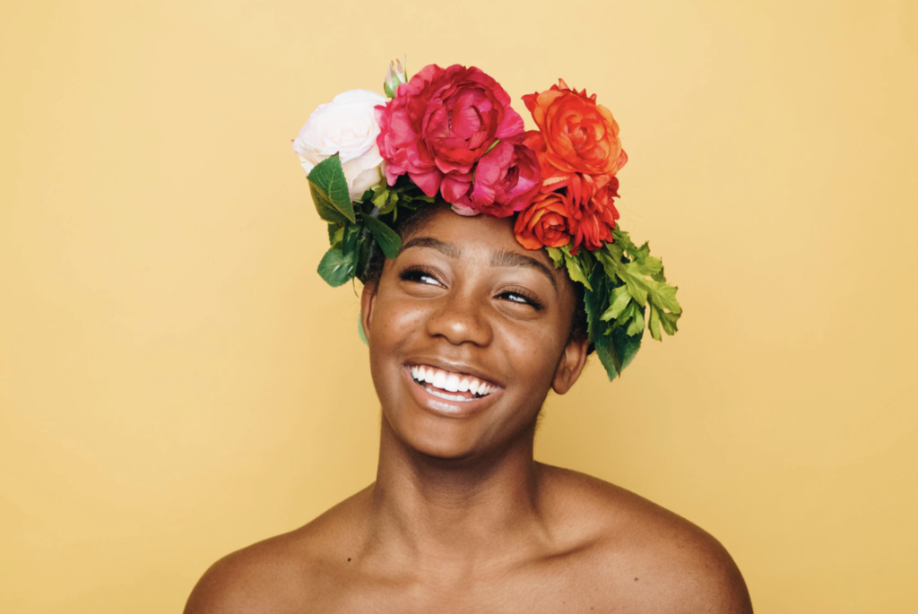 a woman with flower headress clear skin diet