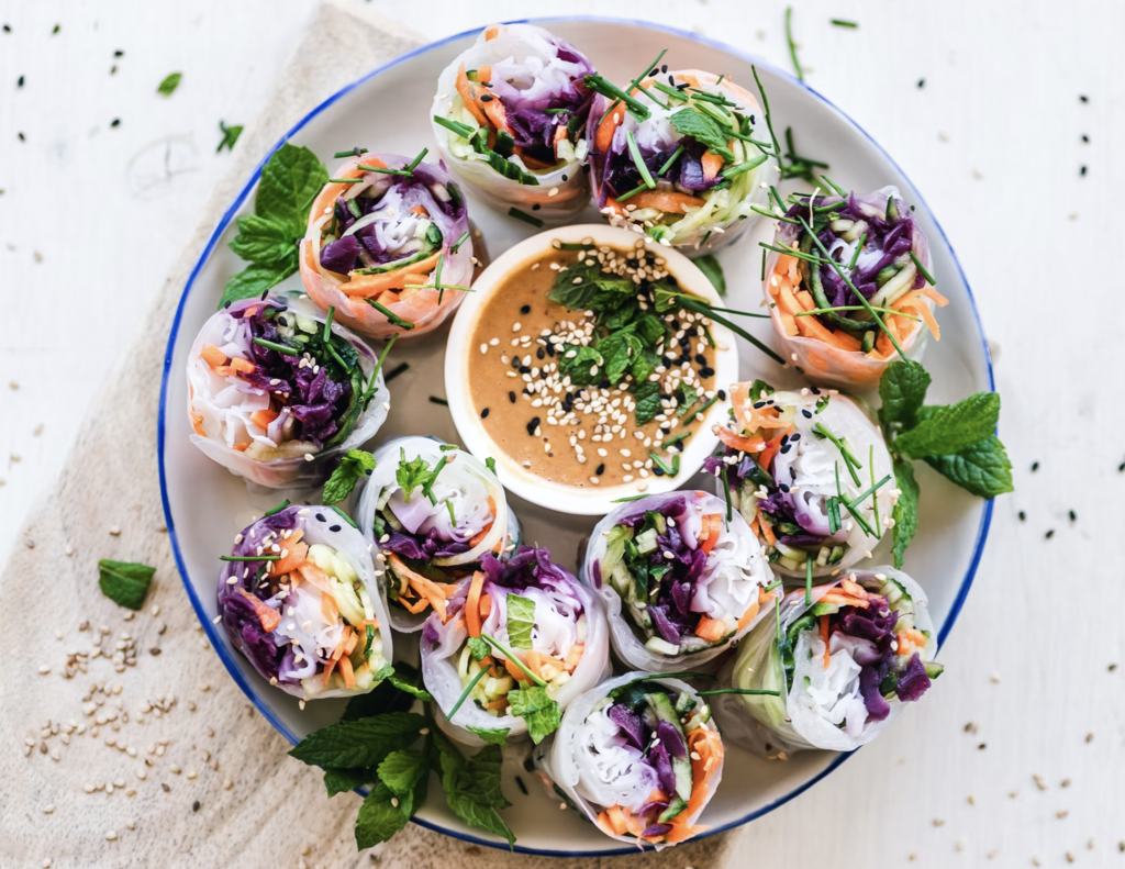 bowl of fresh vegan spring rolls Vegan benefits skin
