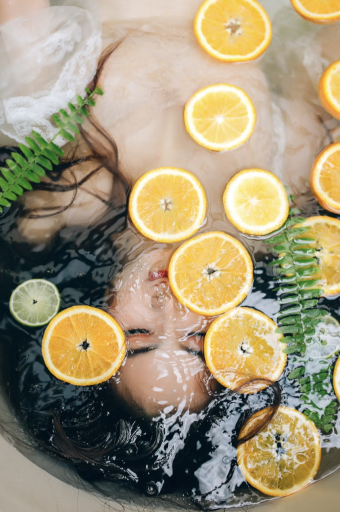 a woman submerged in lemon water natural ingredients for hair