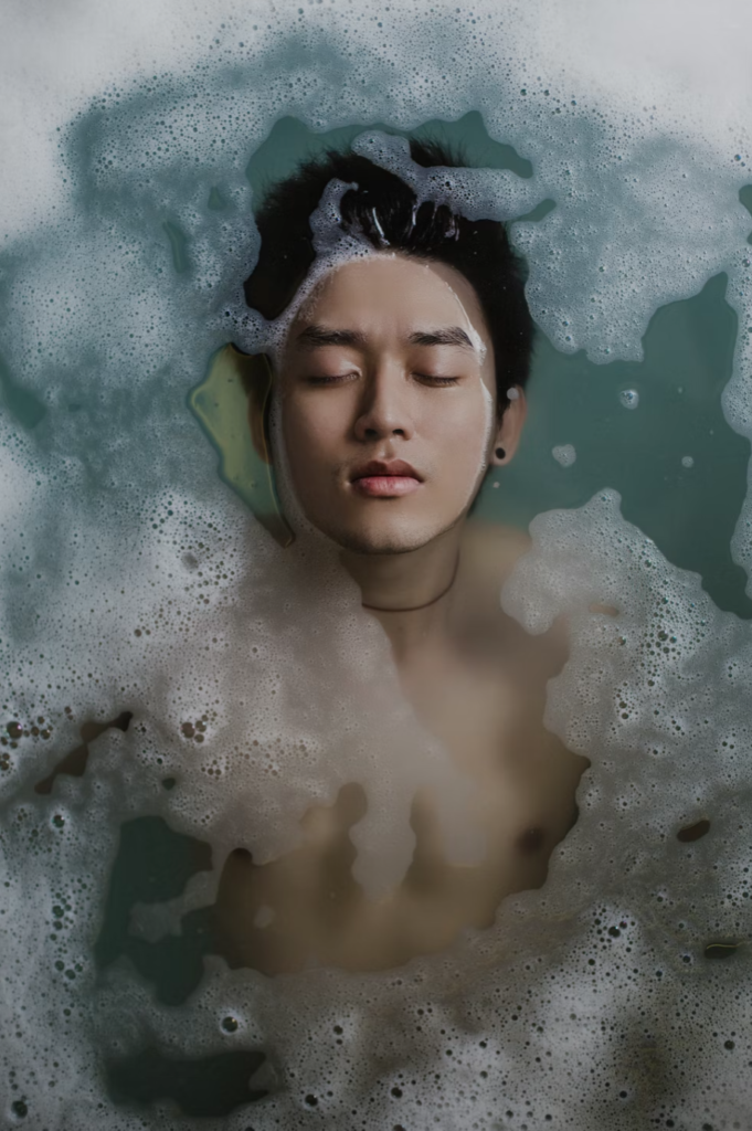 a young man submerged in water