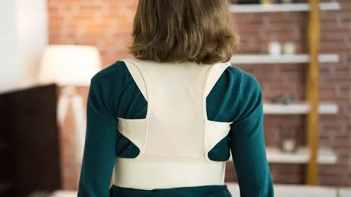 woman wearing a posture corrector